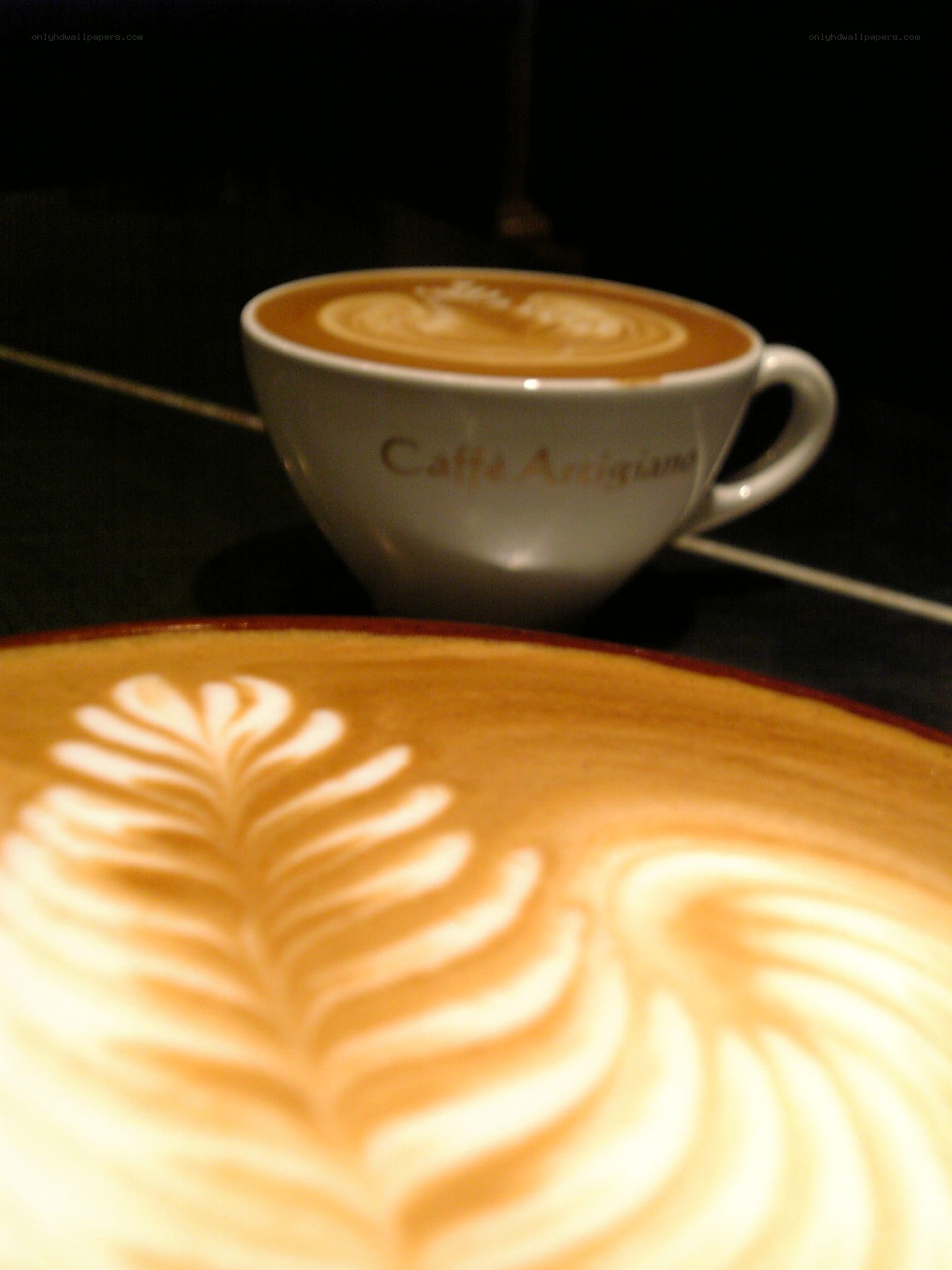 Latte art in coffee cups