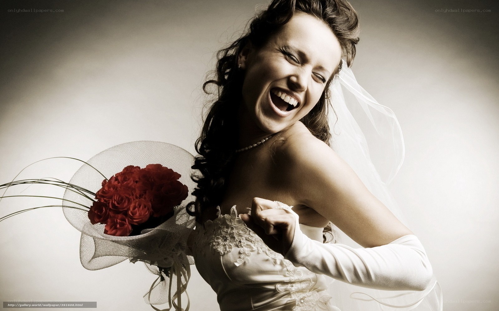 Laughing bride with red roses