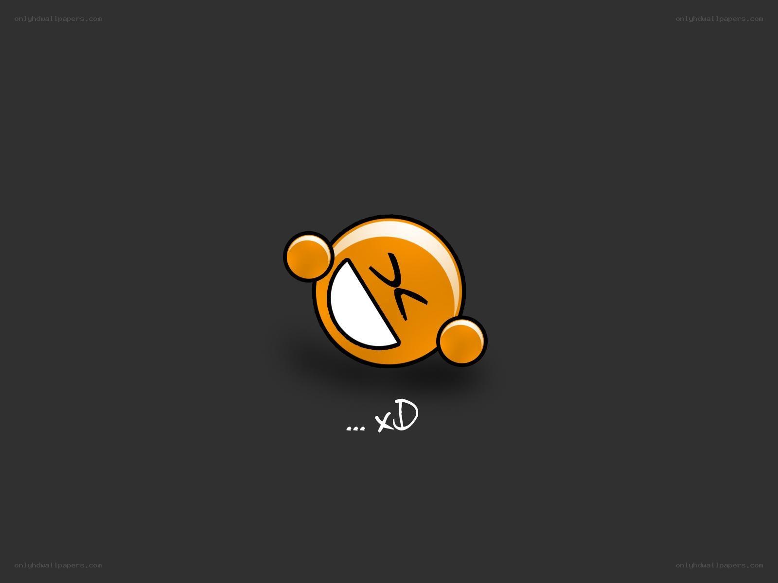 laughing emoji on dark background
