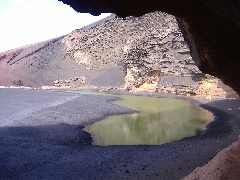 Lava cave view of green lake