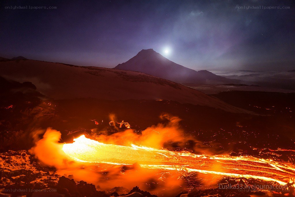 Lava flow at night with moon