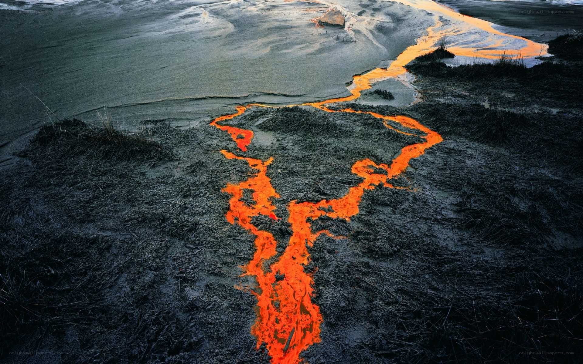 Lava flow on dark terrain
