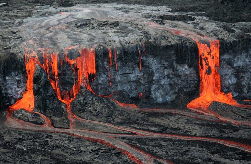 Lava flows from volcanic cliff