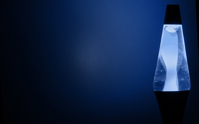Lava Lamp on Dark Surface — Blue