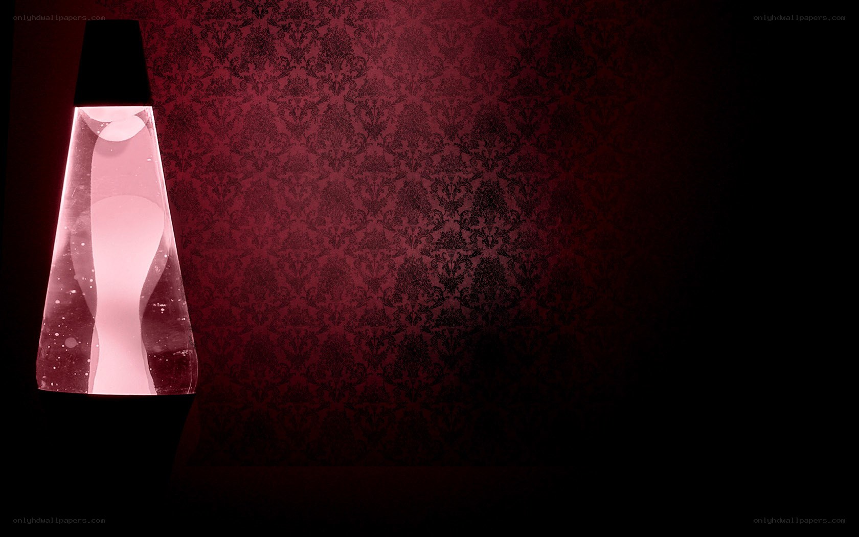 lava lamp on red wallpaper