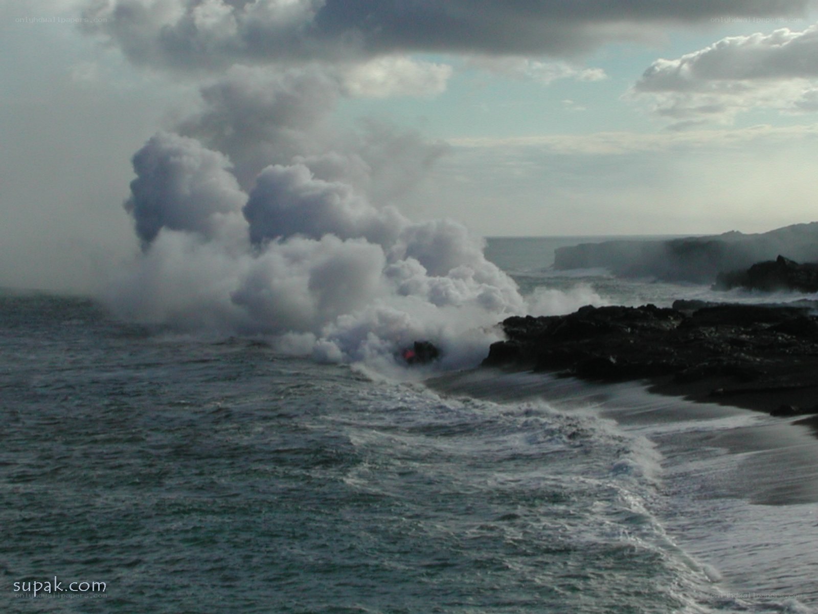 Lava meets ocean at coast