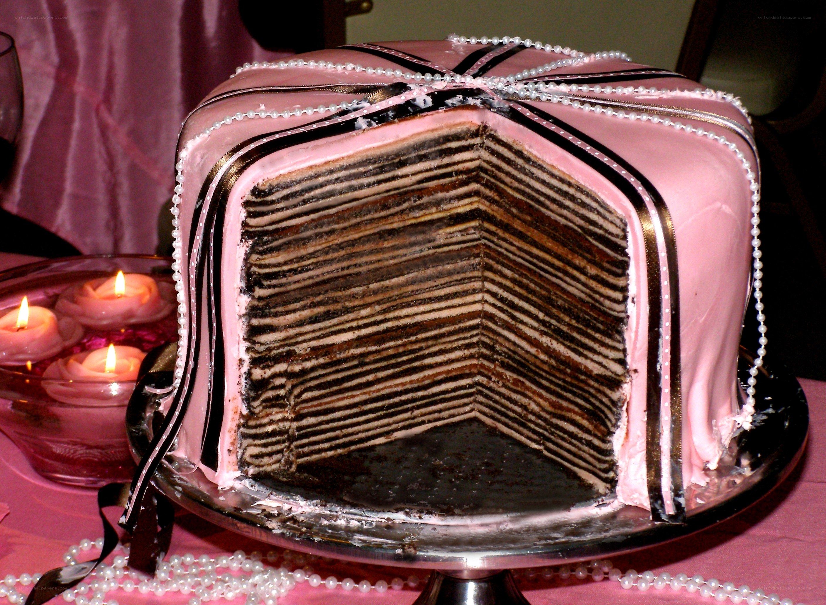 layered cake with pink frosting