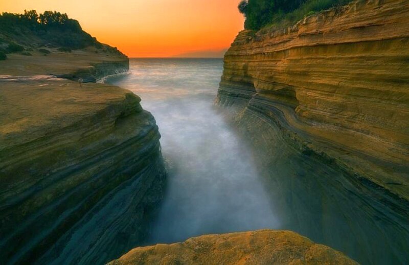 Layered Cliffs at Sunset — Orange
