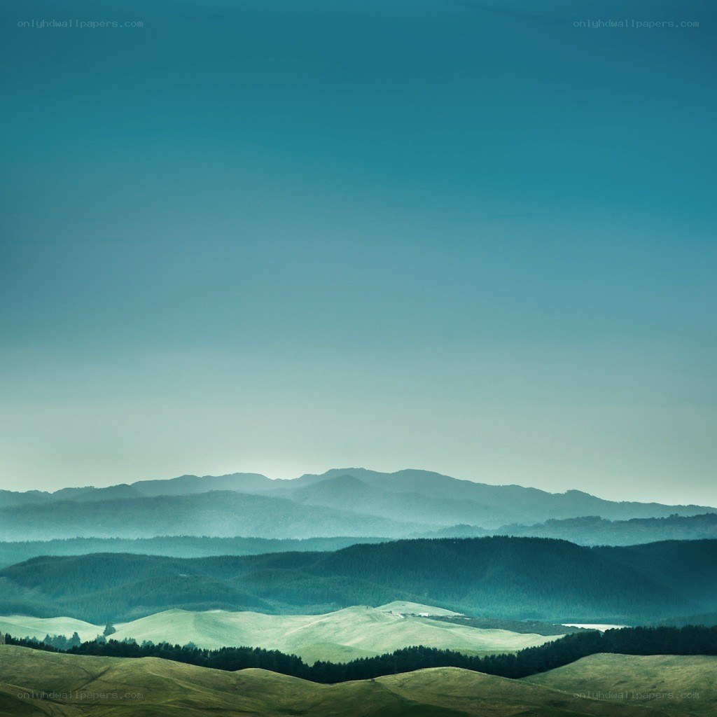 Layered hills under a blue sky