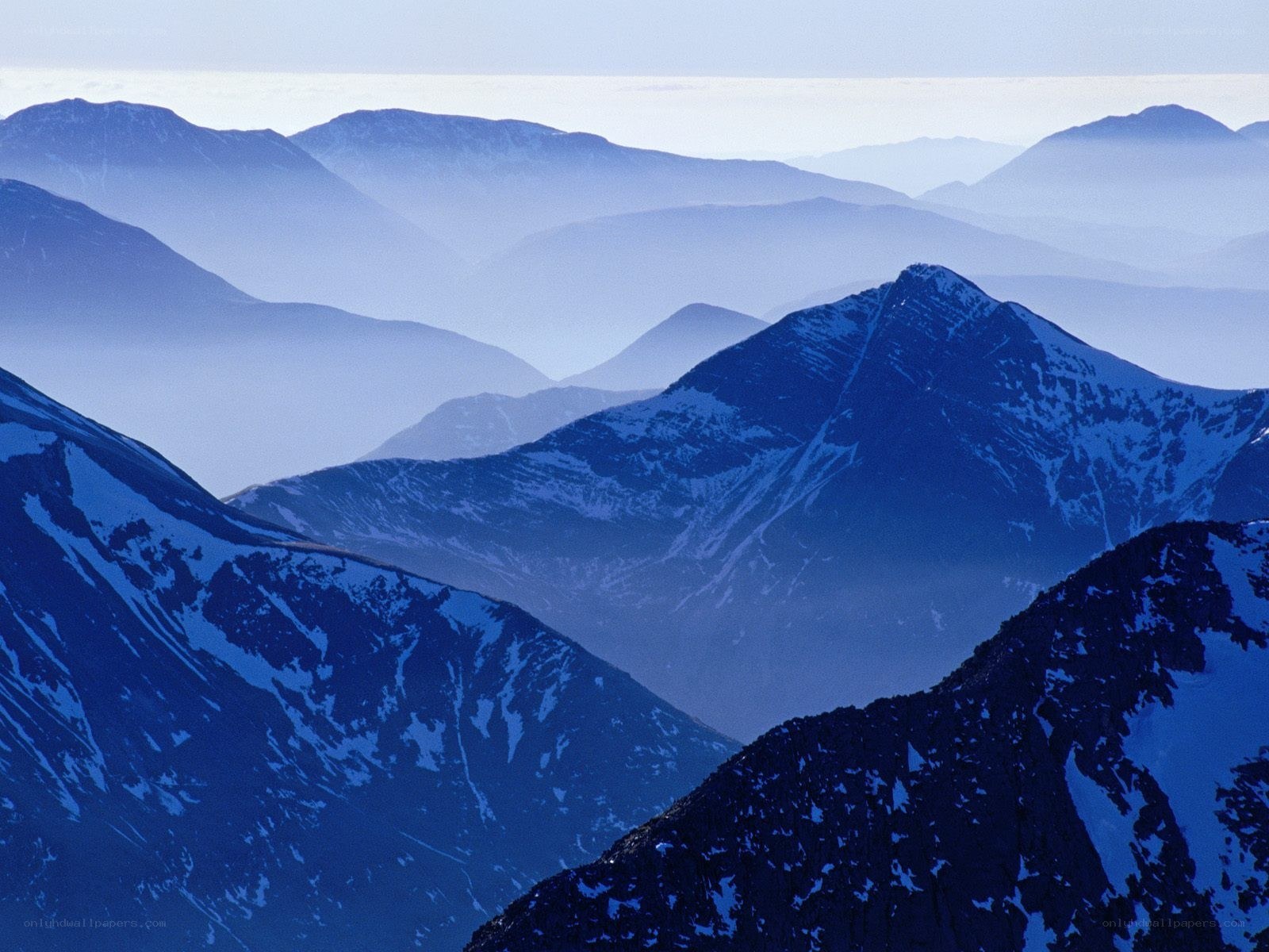 Layered mountain peaks at dawn