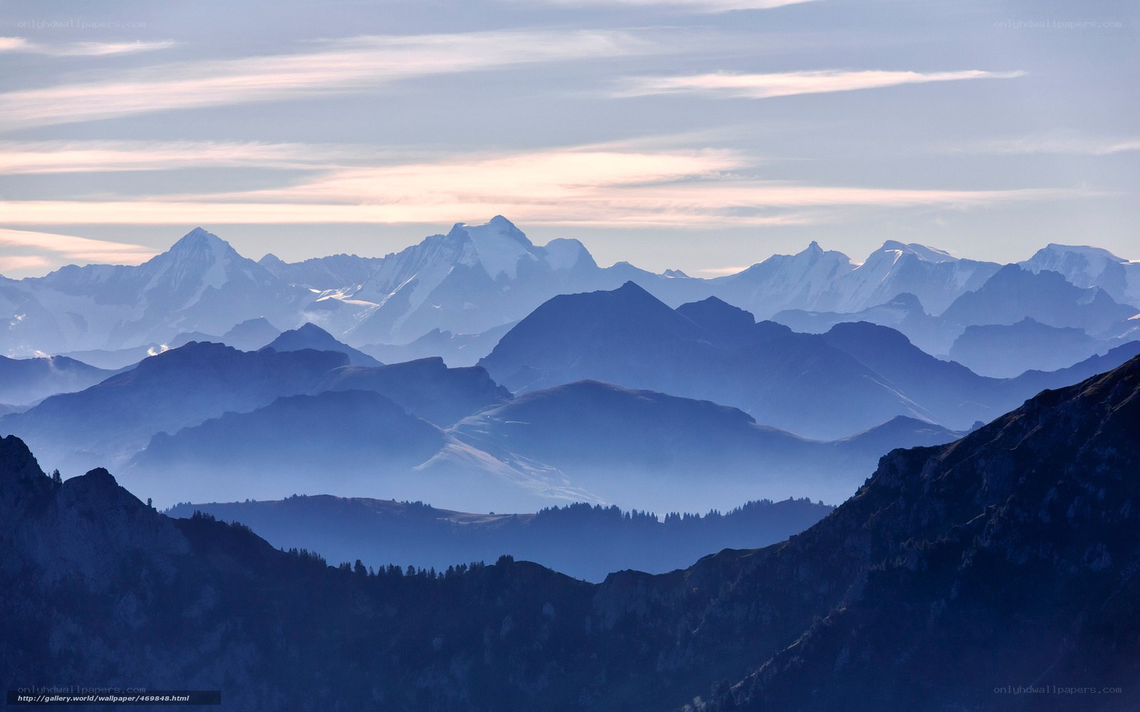 Layered mountain ranges at dawn