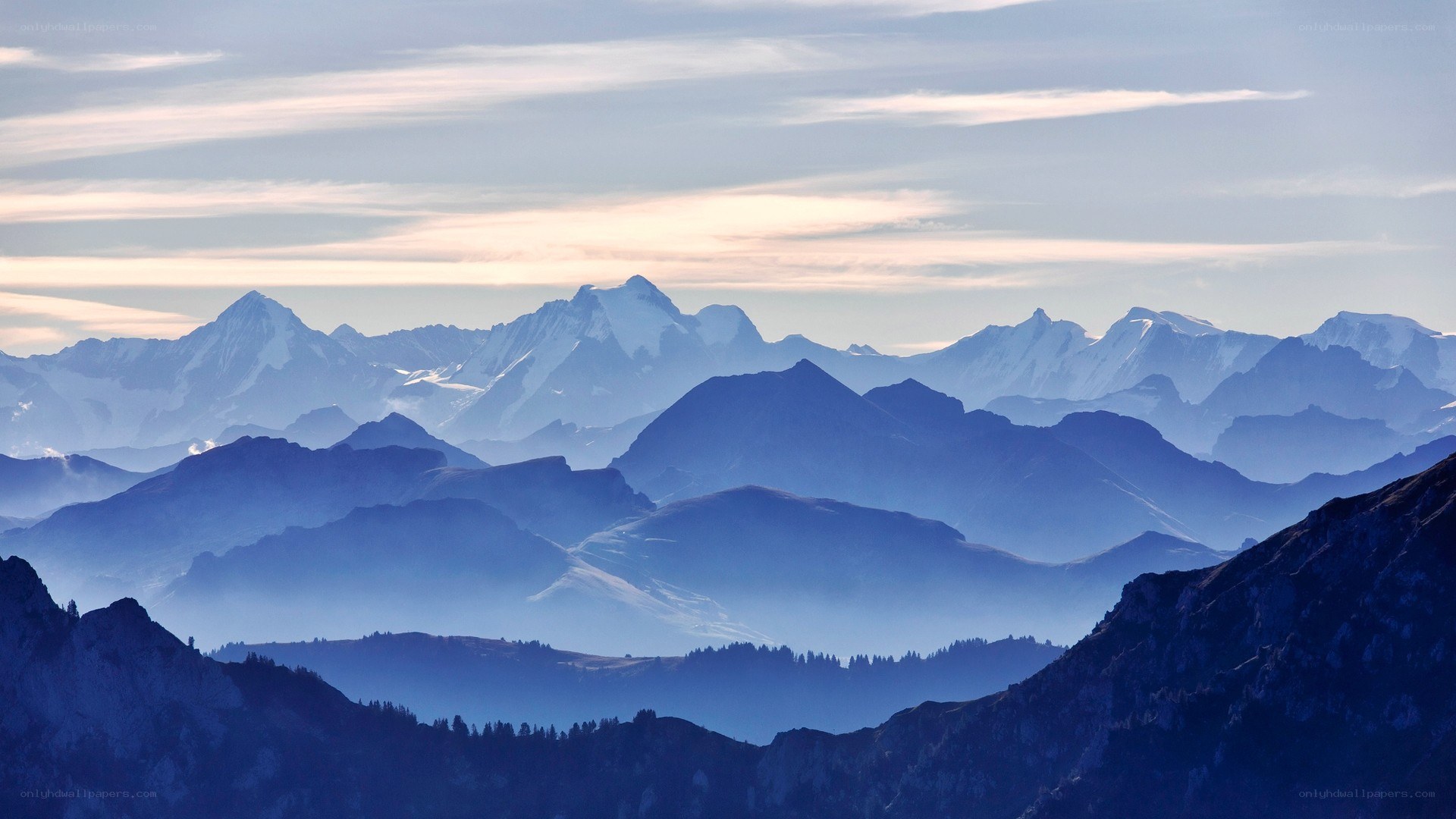 Layered mountain ranges at dawn