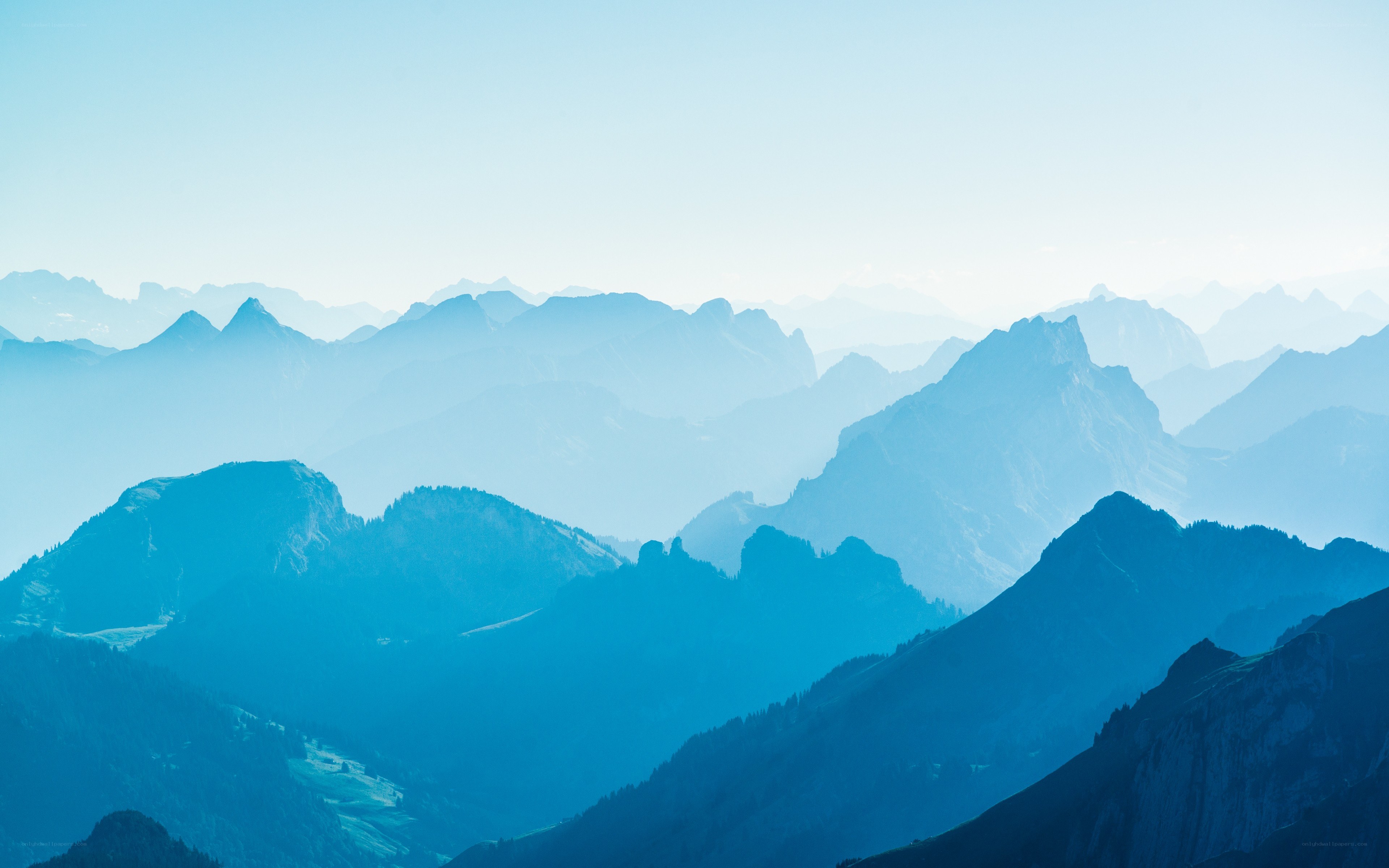 Layered mountain ranges at dawn