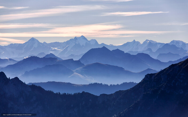 Layered mountain ranges at dawn