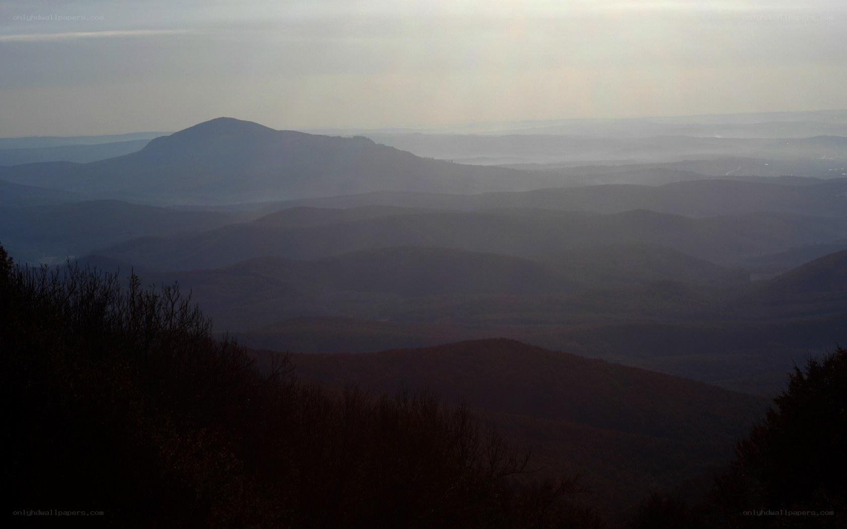 Layered mountain ranges at dusk