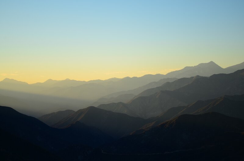 Layered Mountain Ranges — Blue, Serene, Sunset