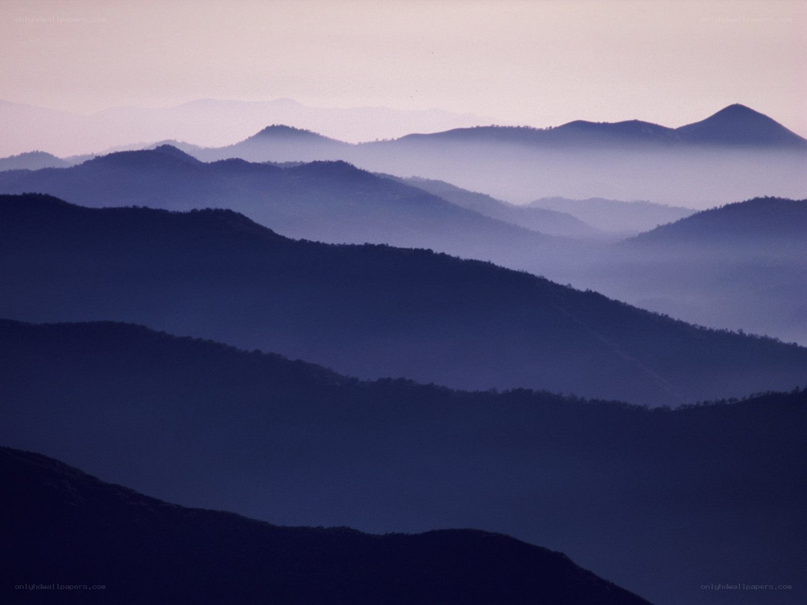 Layered mountains at dawn
