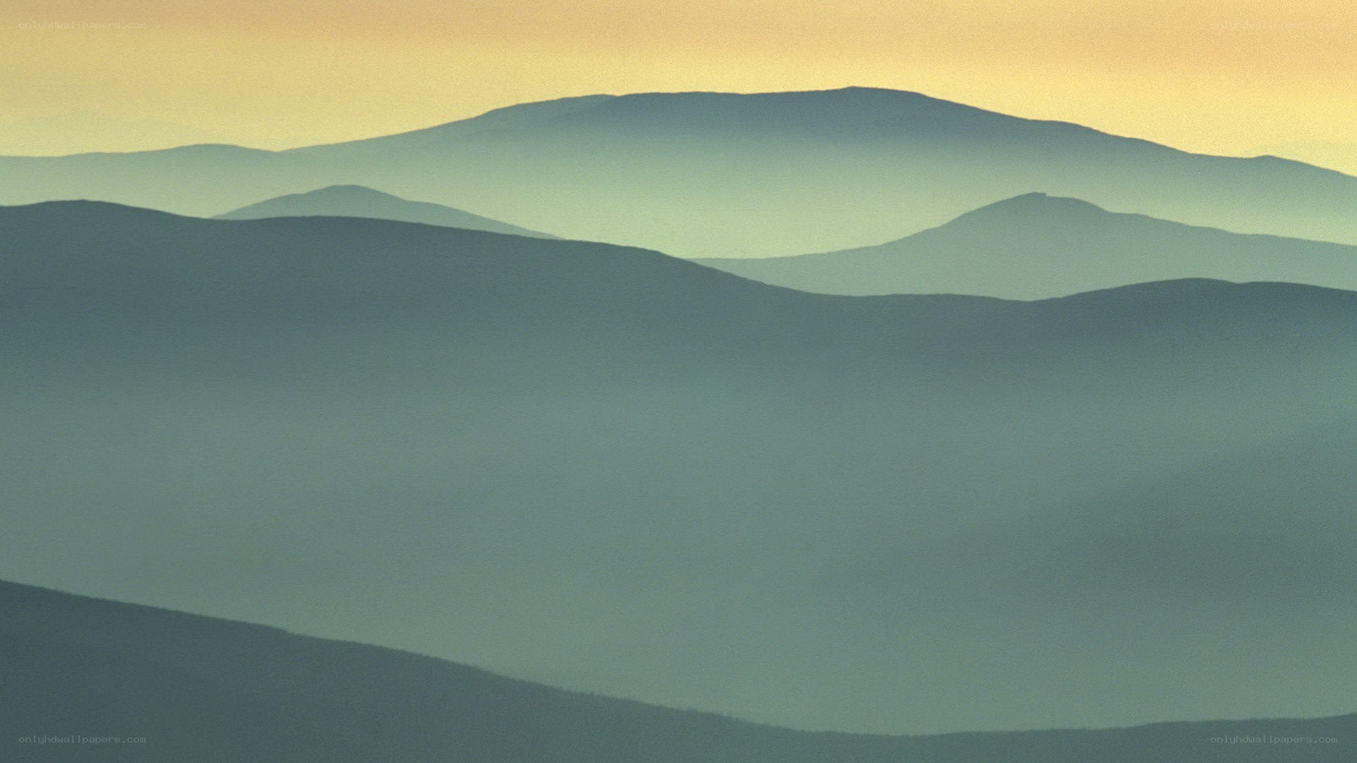 Layered mountains at dawn