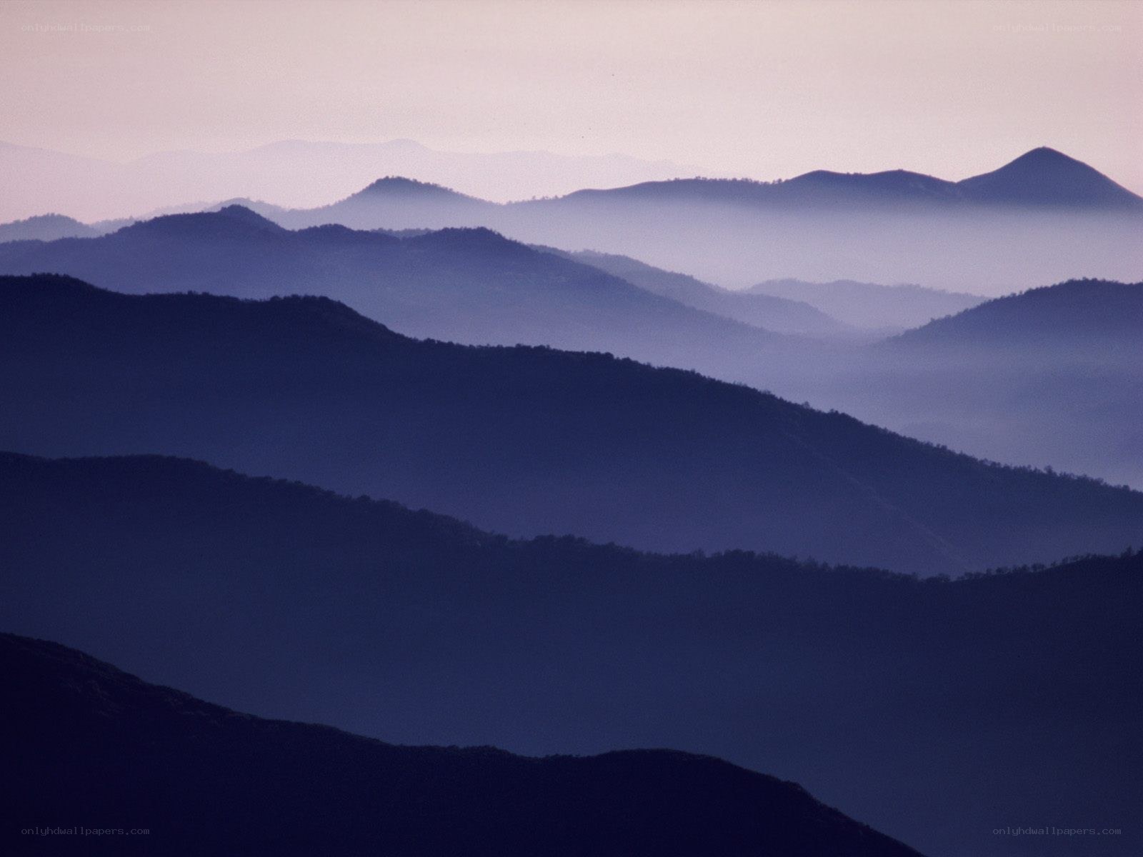 Layered mountains at dawn