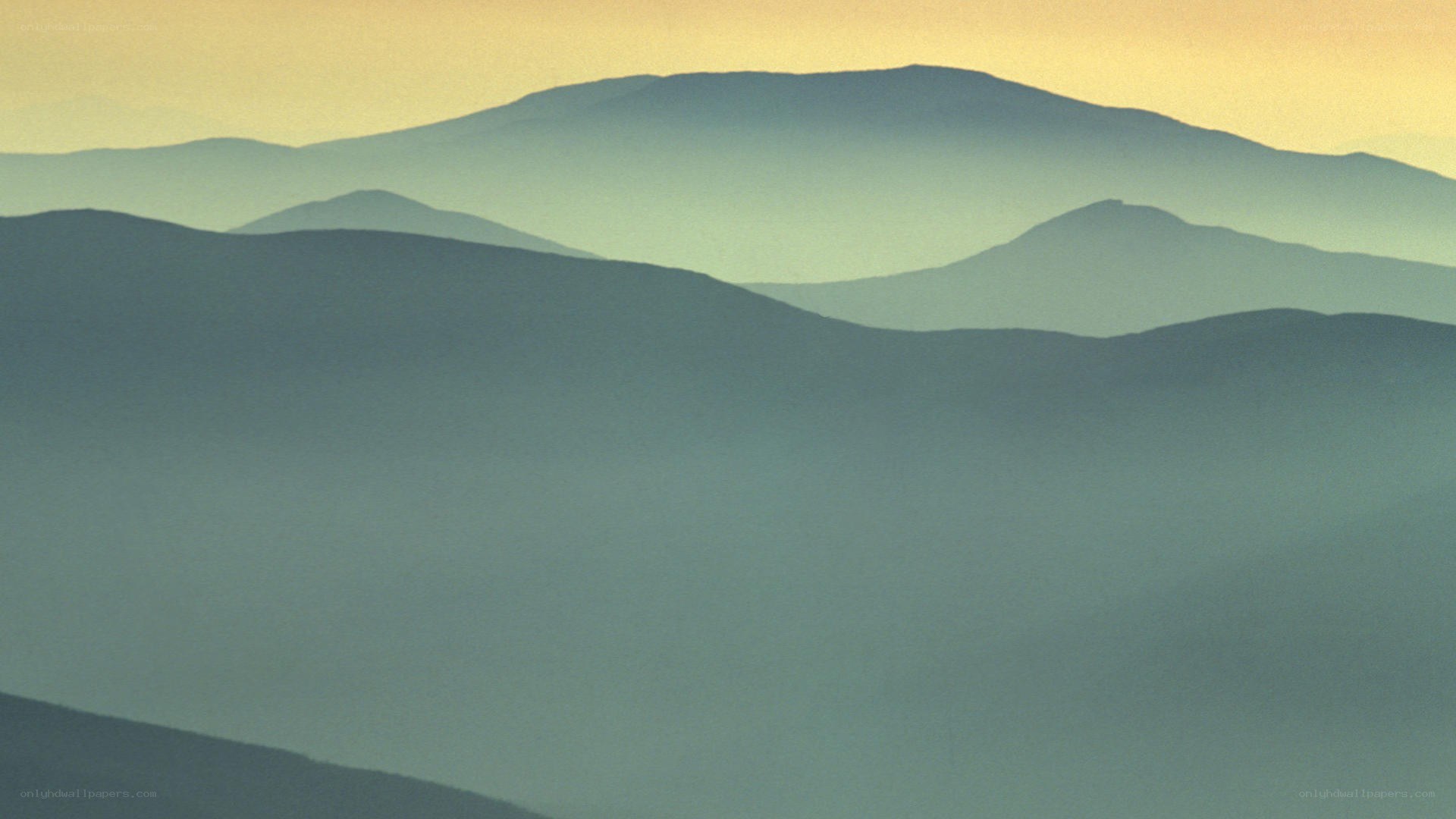 Layered mountains at dawn