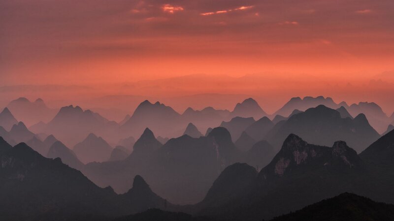 Layered Mountains at Dusk — Orange