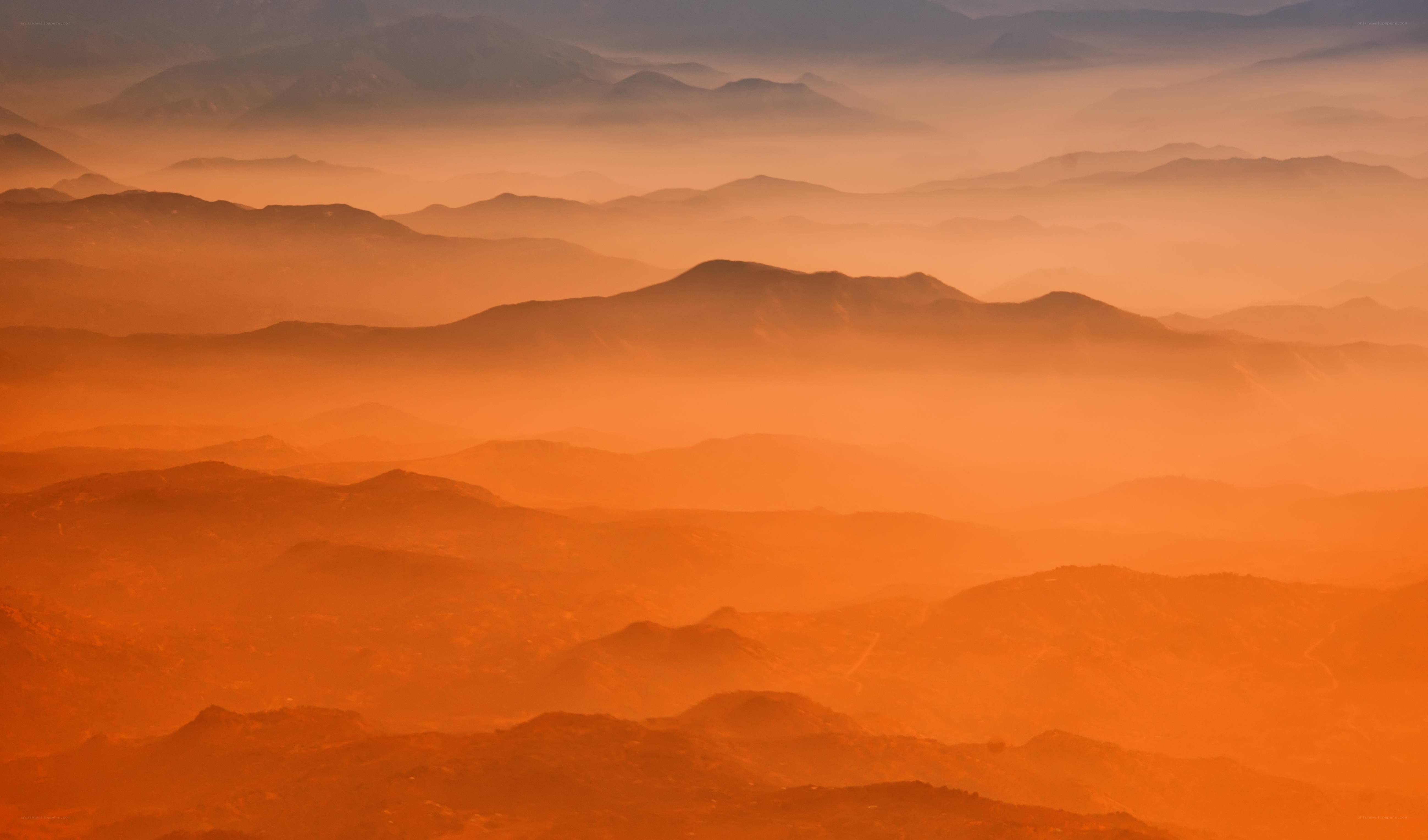 Layered mountains at sunrise