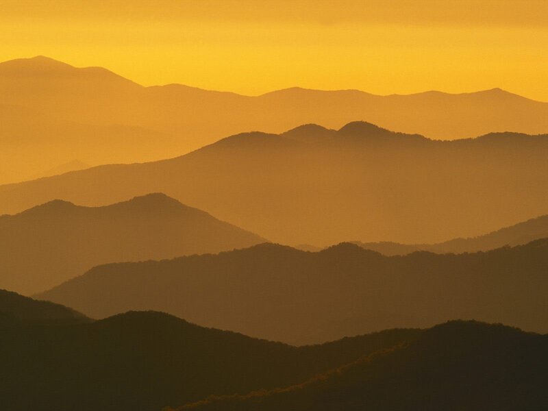 Layered mountains at sunset