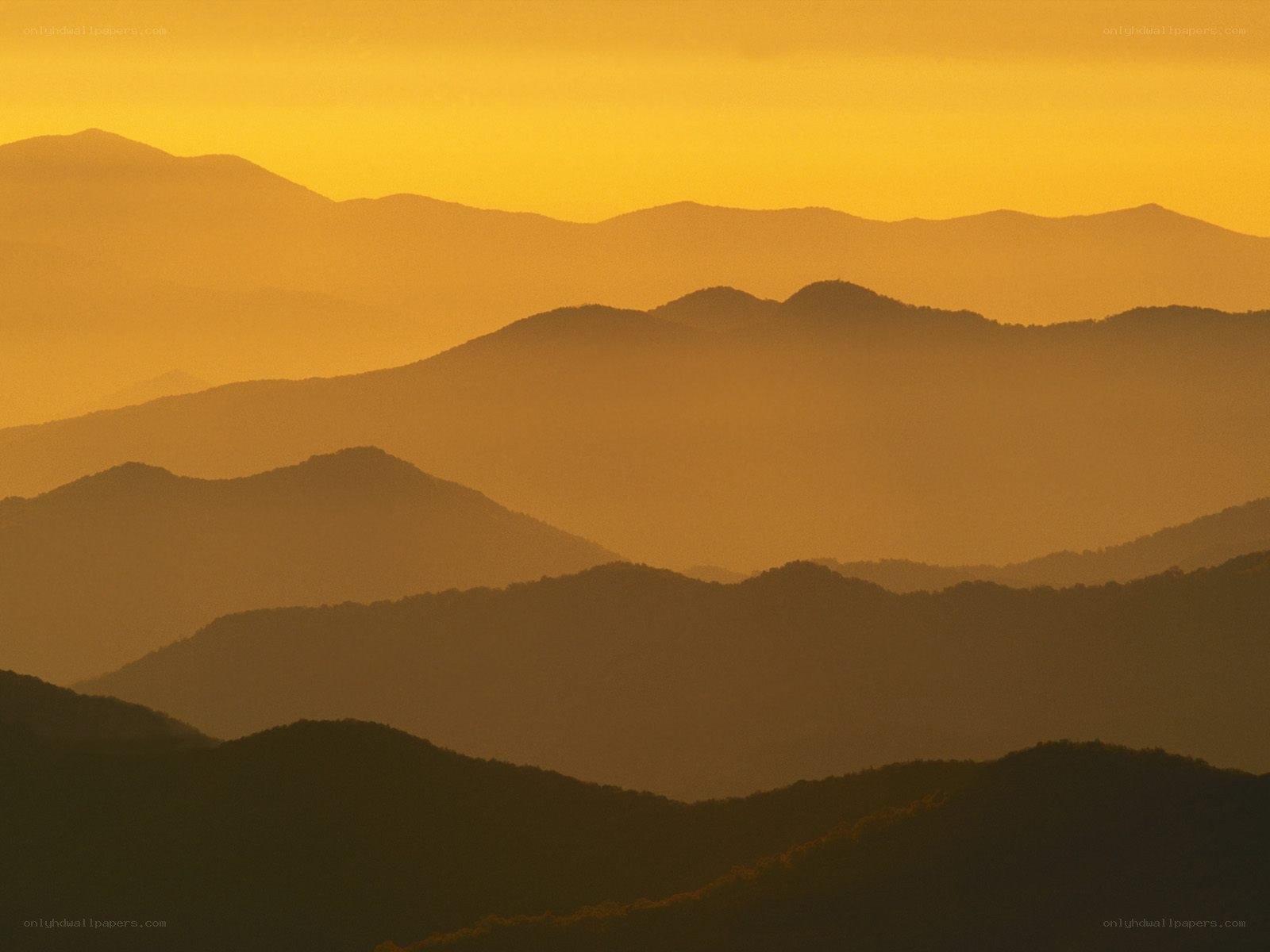 Layered mountains at sunset