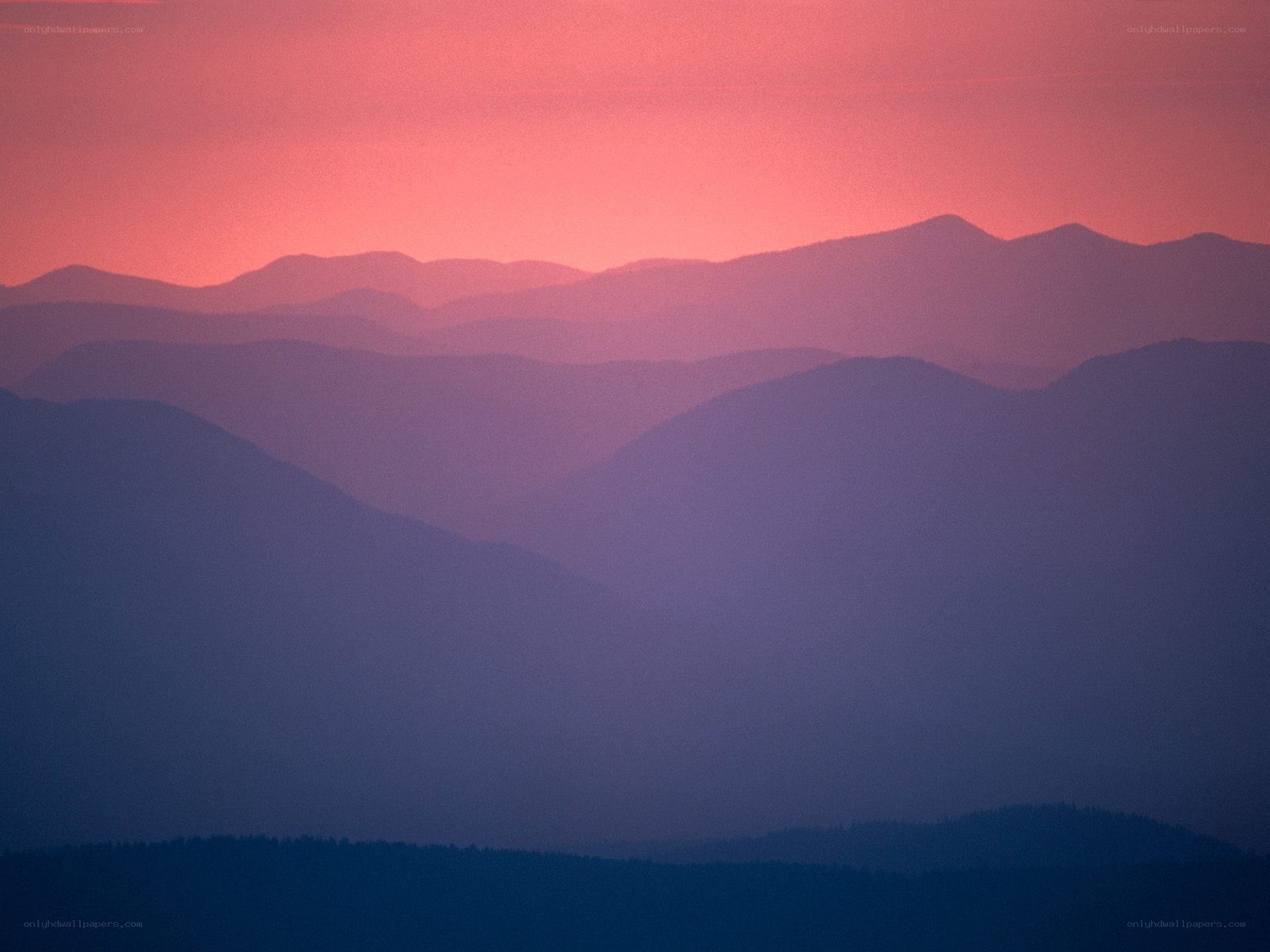 Layered mountains at sunset