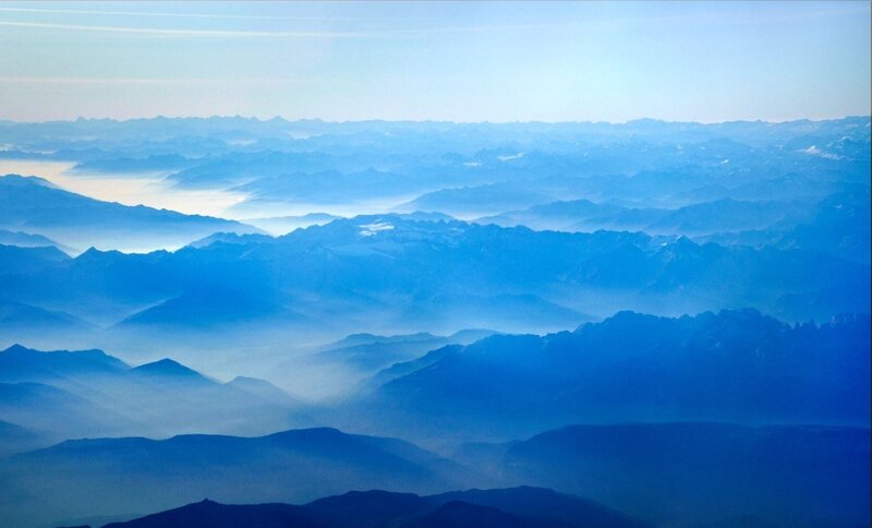 Layered mountains in blue haze