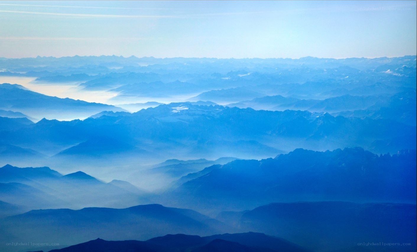 Layered mountains in blue haze