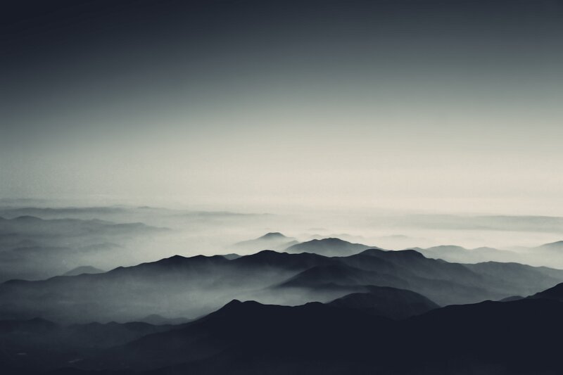 Layered Mountains in Fog — Gray