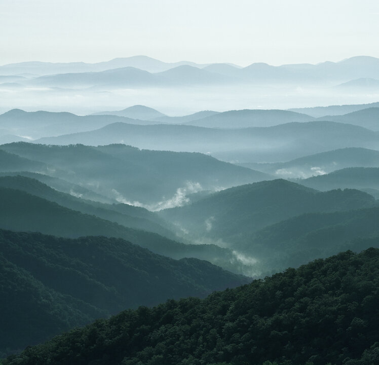 Layered mountains in mist