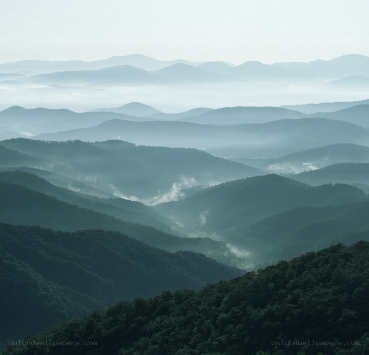Layered mountains in mist