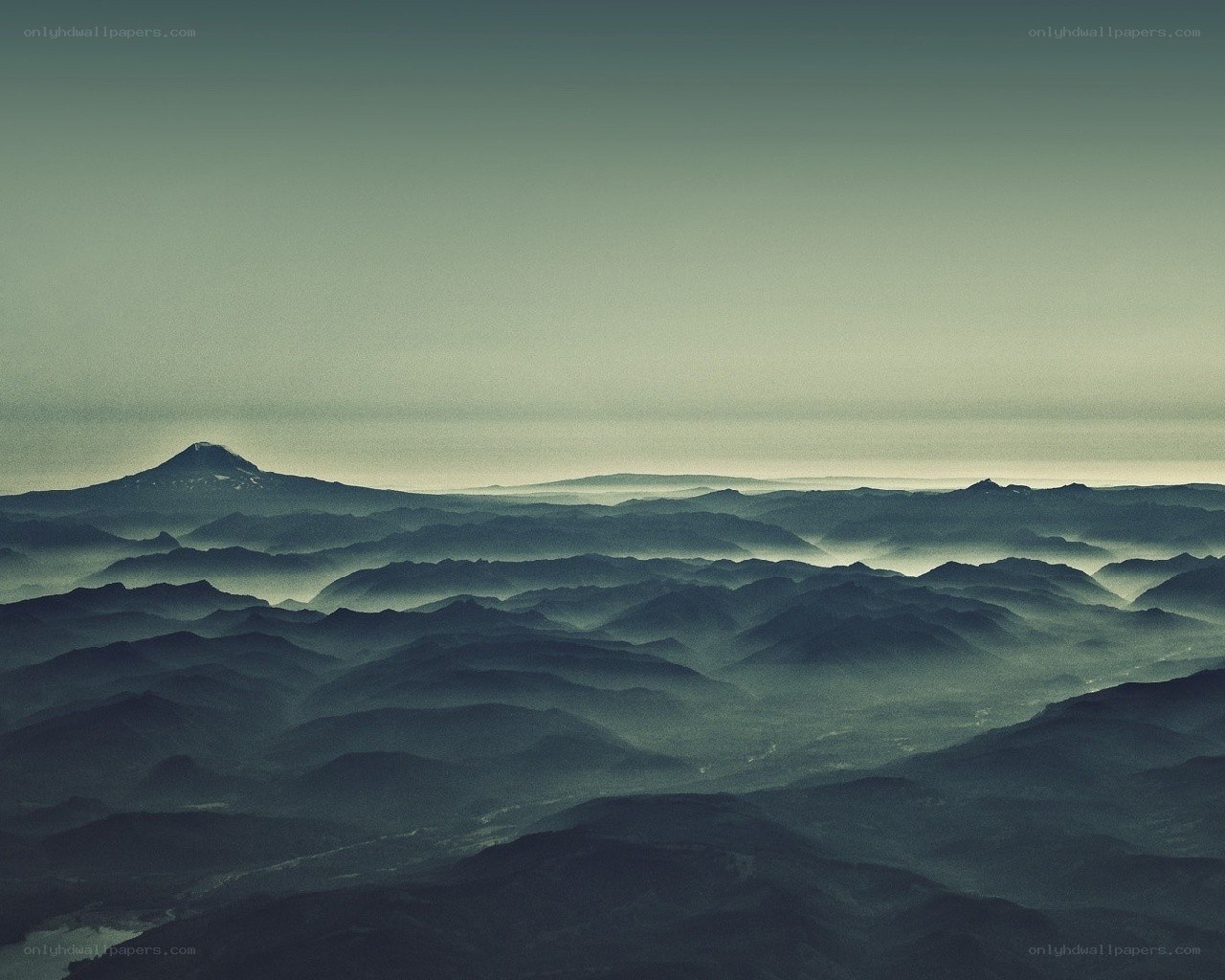 Layered mountains in mist