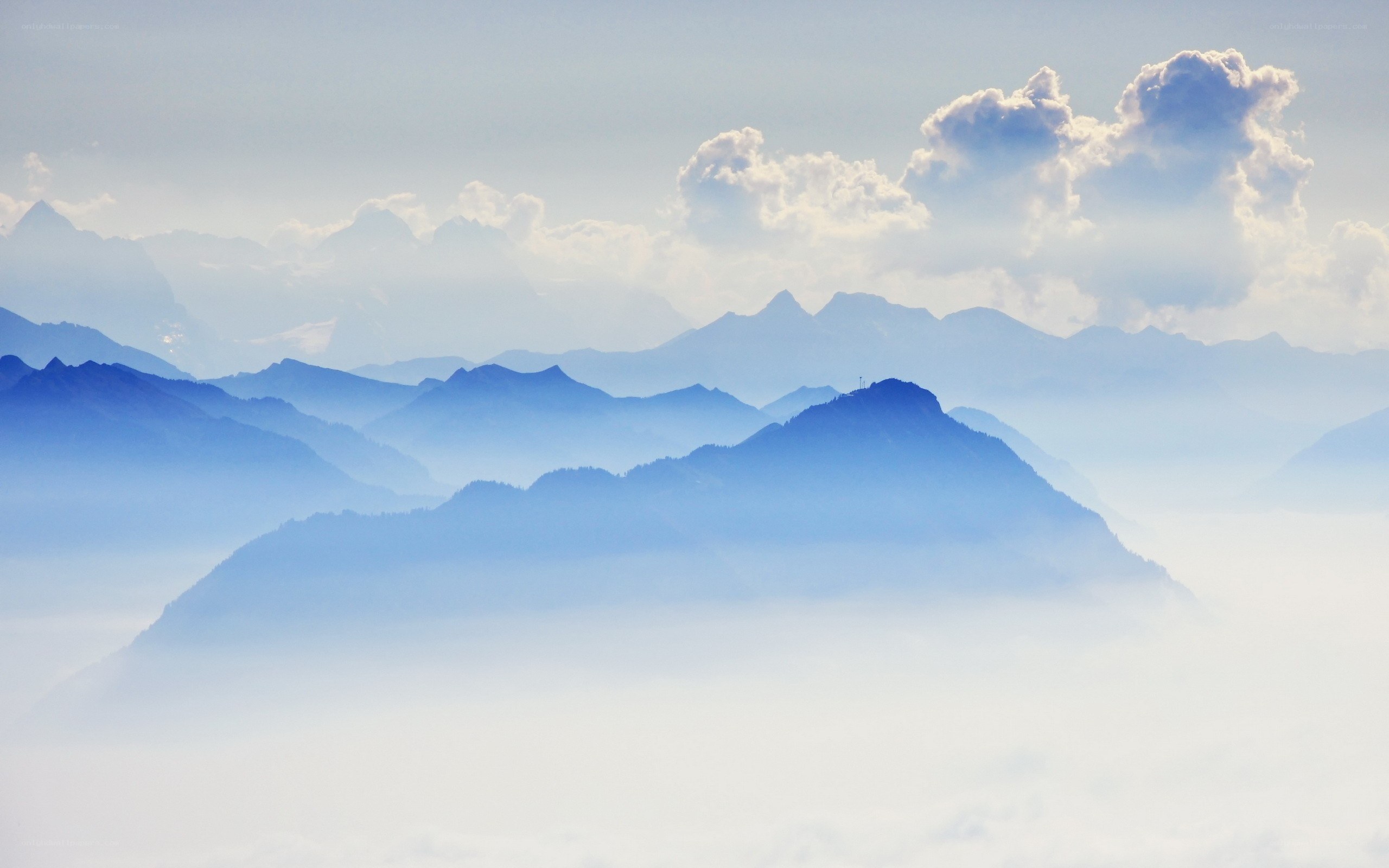 Layered mountains in mist
