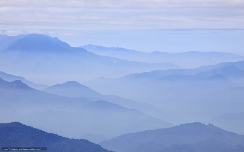 Layered mountains in mist
