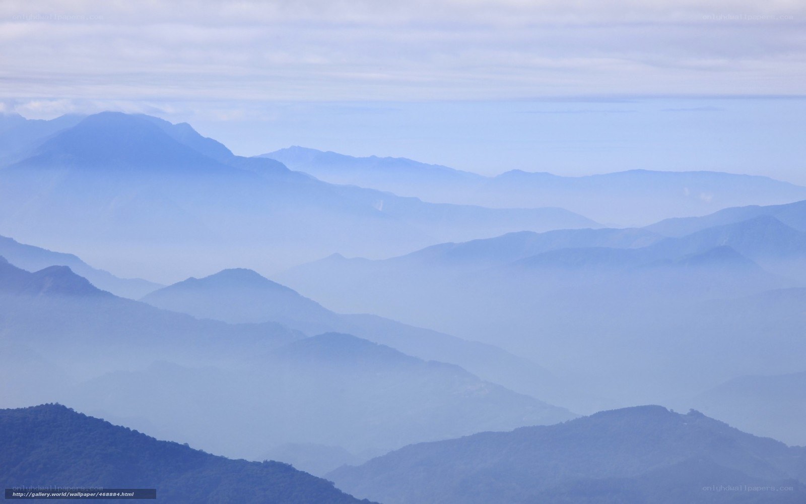 Layered mountains in mist