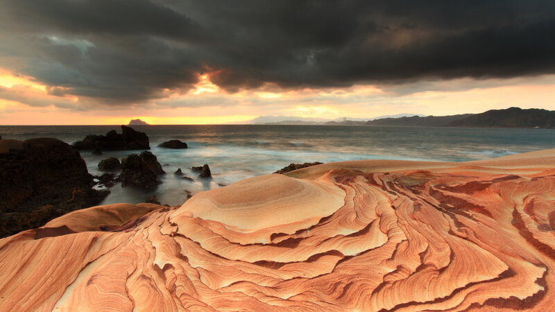 Layered Sandstone Formations — Orange