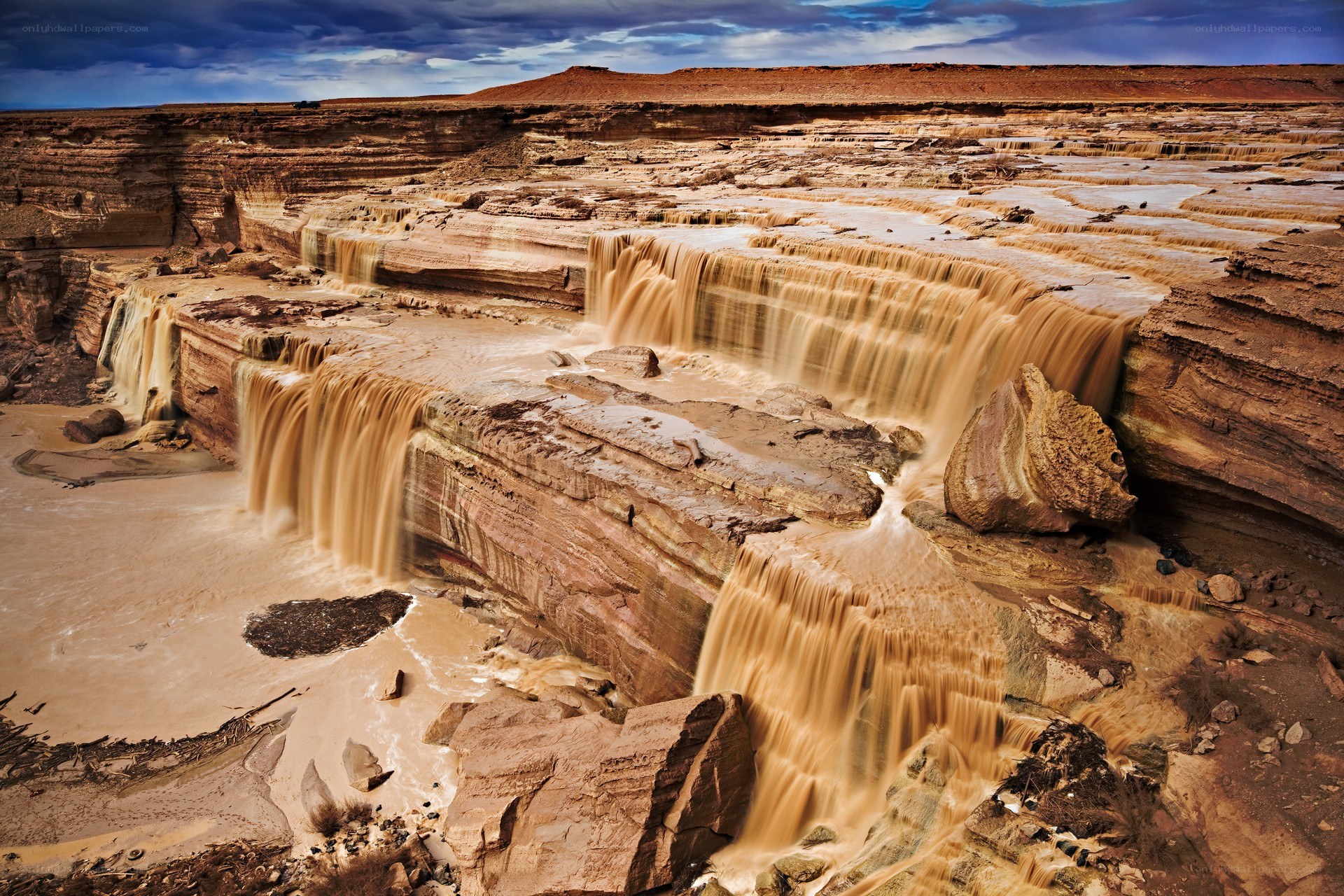 Layered waterfall in desert canyon