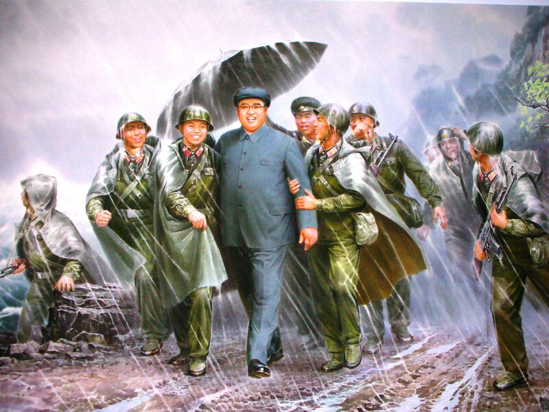 Leader with soldiers in rain