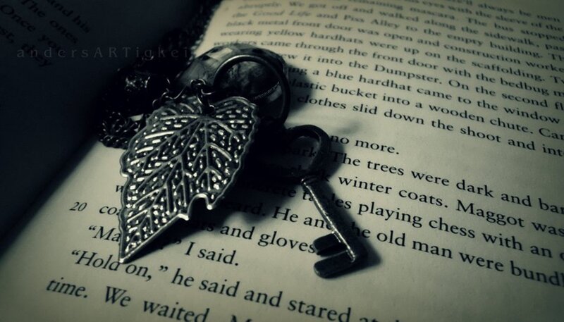 Leaf-shaped Pendant on Book