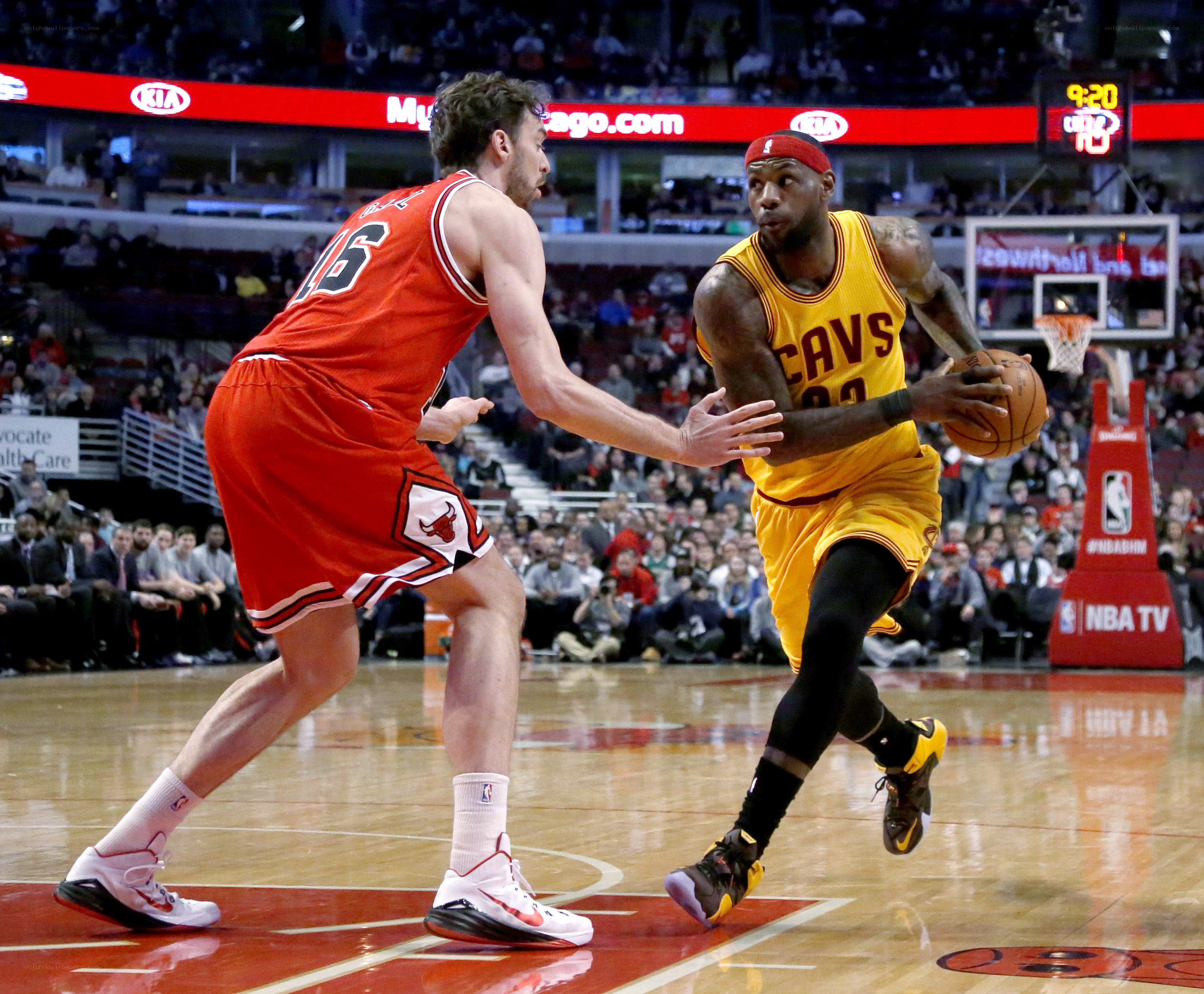 LeBron James drives against defender