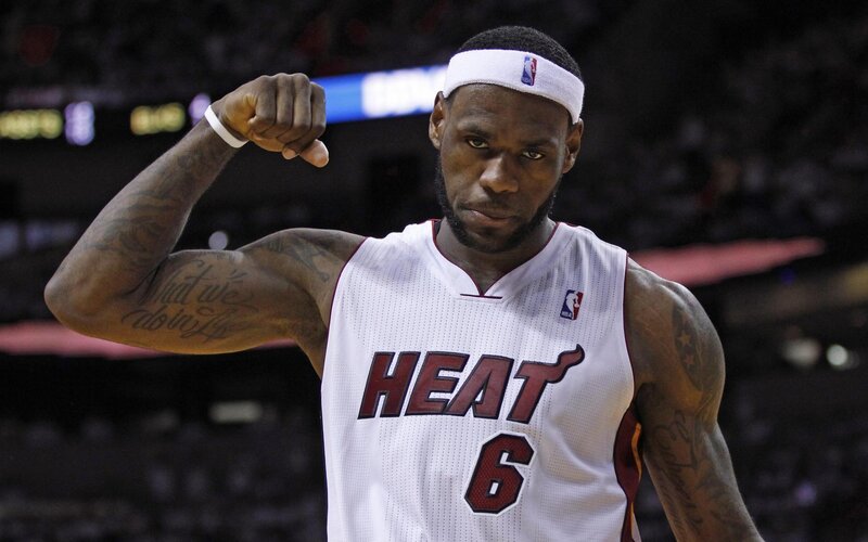 LeBron James flexing in Miami Heat jersey