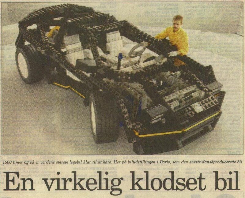 Lego car model in newspaper