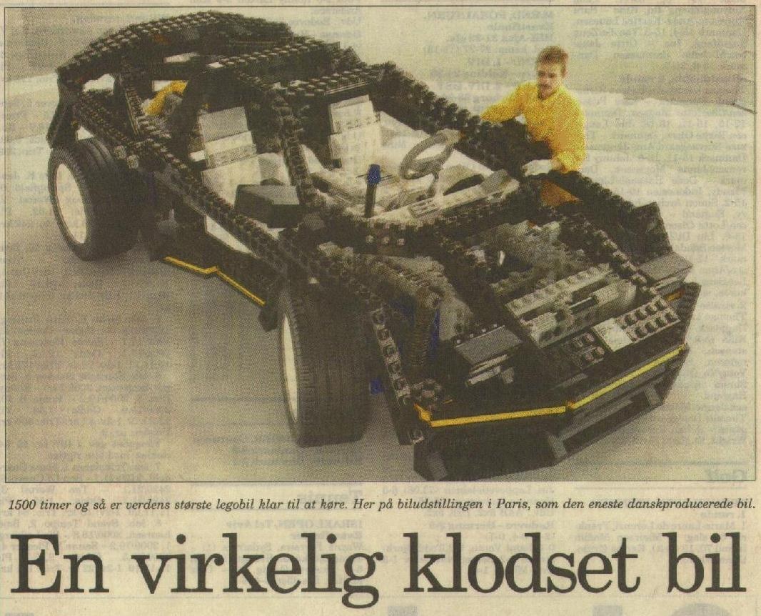 Lego car model in newspaper
