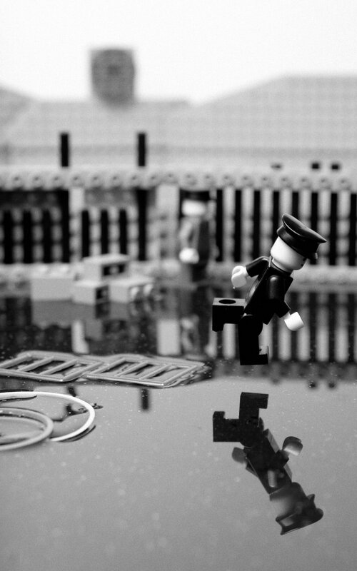 Lego figure in puddle