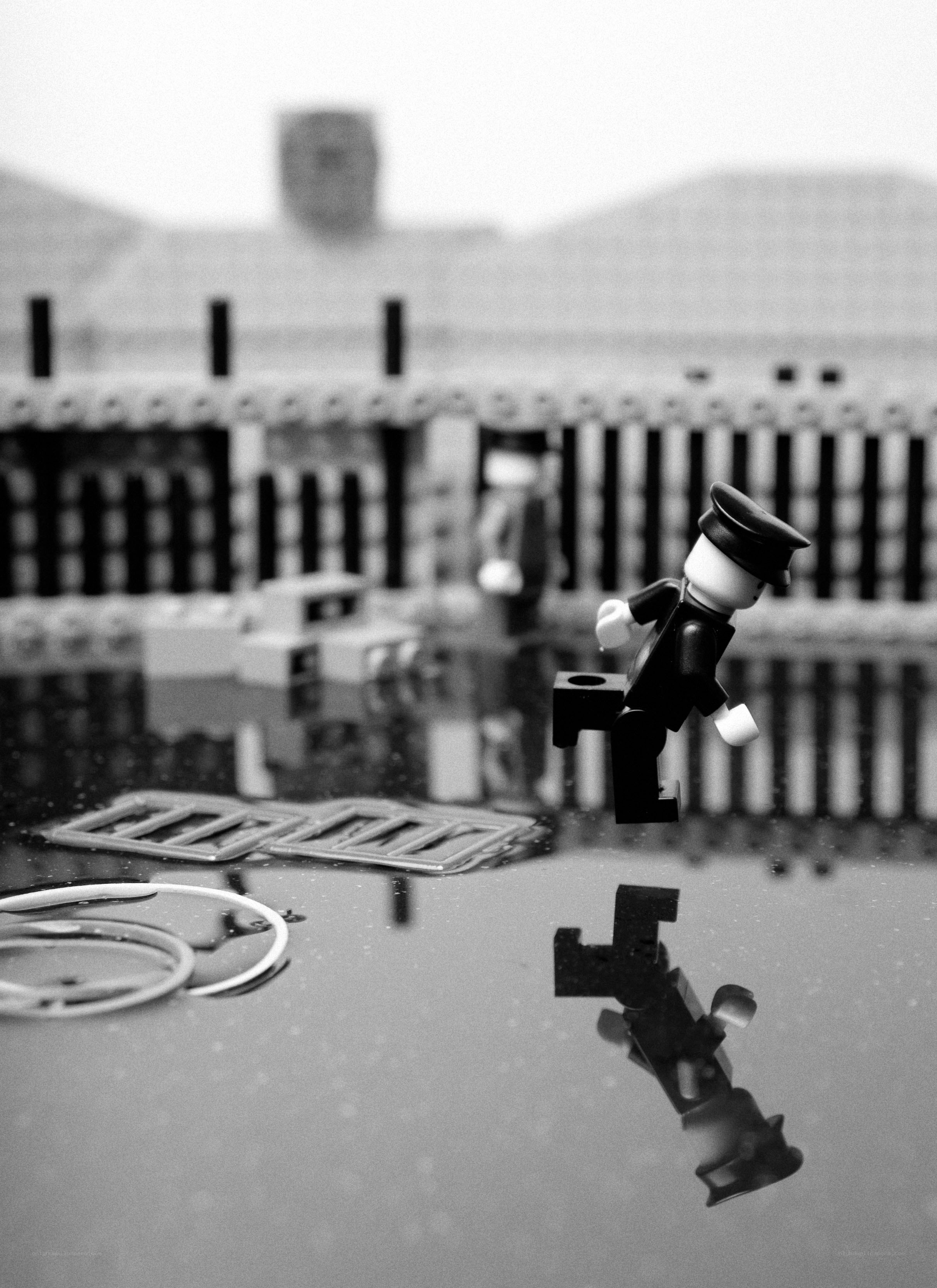 Lego figure in puddle