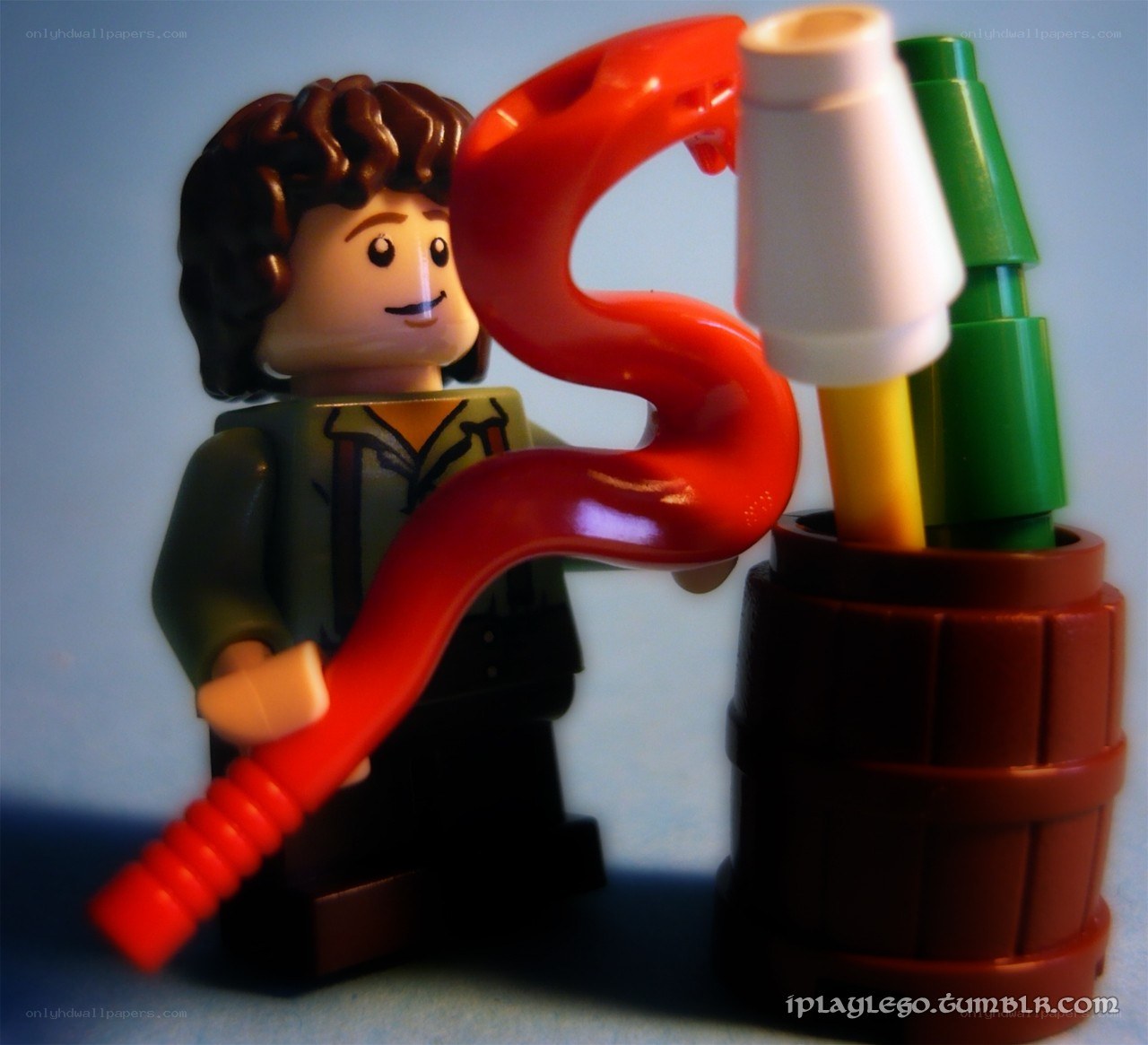 Lego figure with red hose
