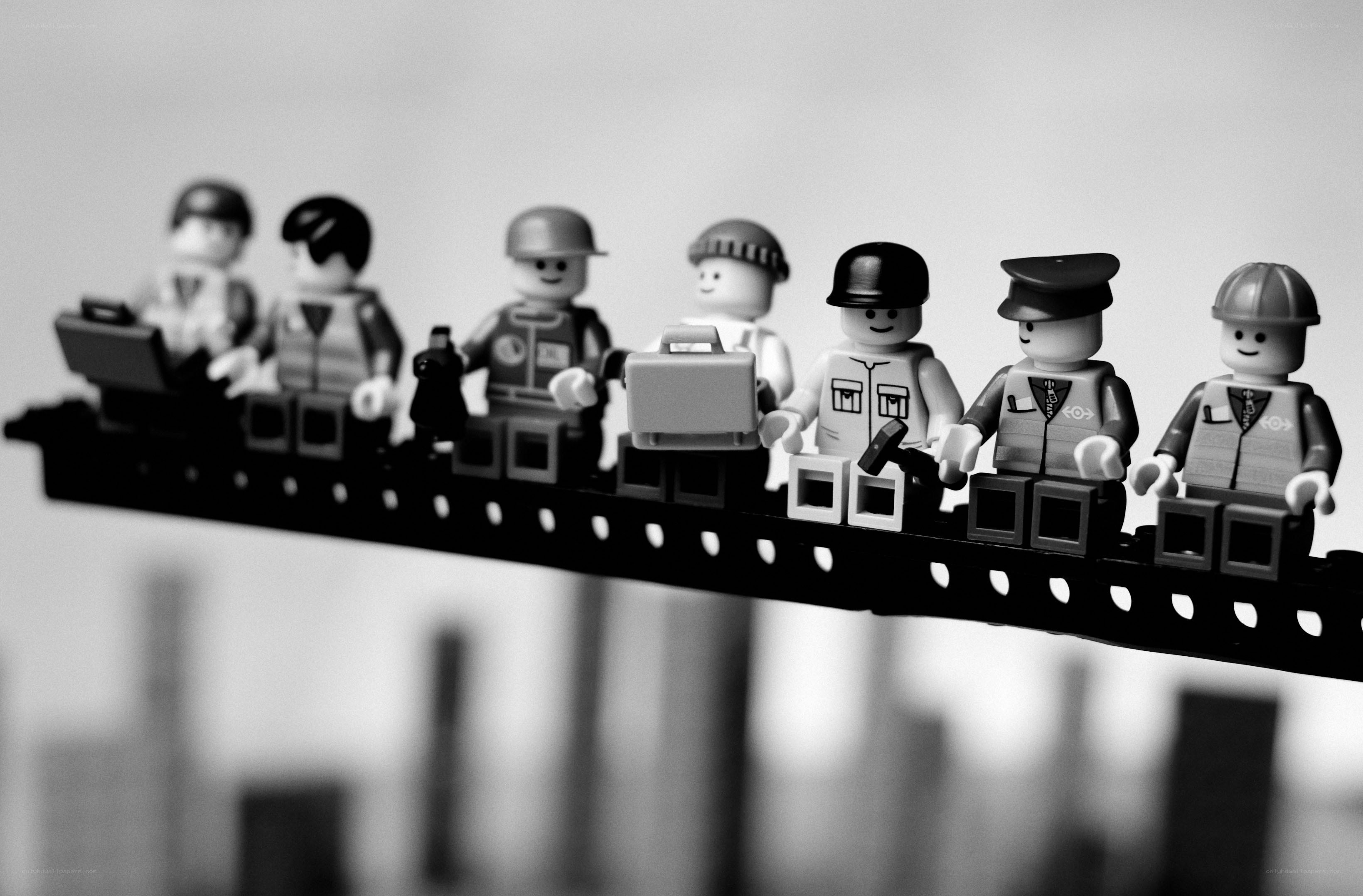 Lego figures on a beam